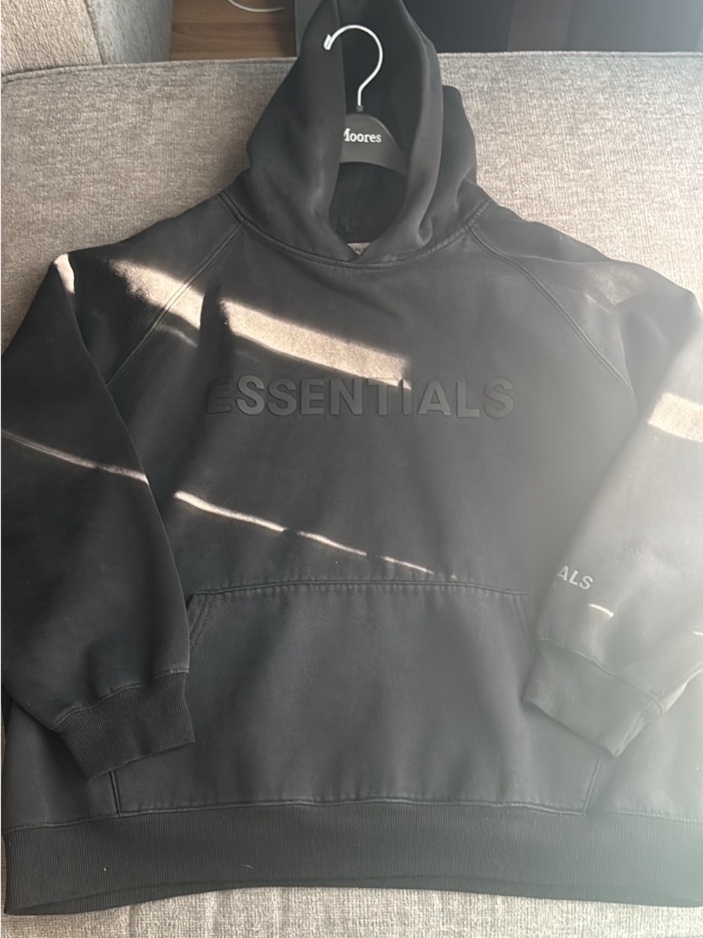 Essentials Black Pullover Hoodie with Subtle Chest Tag